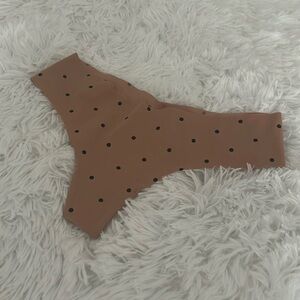 VS thongs in a light brown with black polka dots